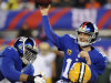 New York Giants quarterback Eli Manning (10) throws a pass as Green Bay Packers' Dezman Moses (54) rushes during the first half of an NFL football game, Sunday, Nov. 25, 2012, in East Rutherford, N.J. (AP Photo/Bill Kostroun)