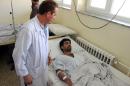 A wounded Afghan receives treatment at a hospital in Kunduz province on August 9, 2015