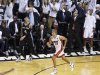 Heat's Battier reacts after hitting a three point basket over Spurs' Green during Game 7 of their NBA Finals basketball playoff in Miami