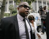 Randy Jackson and Rebbie Jackson, background right, brother and sister of late pop star Michael Jackson, arrive at a courthouse for Katherine Jackson's lawsuit against concert giant AEG Live in Los Angeles, Monday, April 29, 2013. An attorney for Michael Jackson's mother says AEG Live owed it to the pop superstar to properly investigate the doctor held criminally responsible for his death. (AP Photo/Nick Ut)