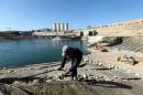 Employees work at strengthening the Mosul Dam