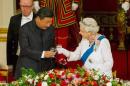 Chinese President Xi Jinping with Queen Elizabeth at a state banquet at Buckingham Palace, London, during the first day of his state visit to Britain