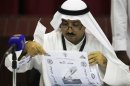 A judge counts votes elections closed at the Khaldiya polling station in District 3, Kuwait City