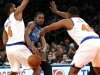 Oklahoma City Thunder forward Durant passes between New York Knicks' Thomas and White during their NBA basketball game in New York