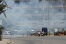 Smoke from clashes rises near the Sunni Muslim Bab al-Tebbaneh neighbourhood in Tripoli, northern Lebanon