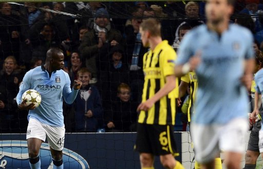 Manchester City's Balotelli gestures after scoring a penalty kick against Borussia Dortmund during their Champions League Group D soccer match in Manchester