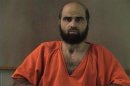 Handout photo of Nidal Hasan, charged with killing 13 people and wounding 31 in a November 2009 shooting spree at Fort Hood.