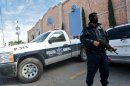 A member of the local police stands guard on January 31, 2012 in Ciudad Juarez