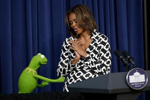 Kermit the Frog joins First Lady Michelle Obama at a screening of Disney's "Muppets Most Wanted" at the Eisenhower Executive Office Building March 12, 2014 in Washington, DC