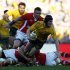 Australia's Berrick Barnes is tackled by Wales players during their international rugby test match in Sydney