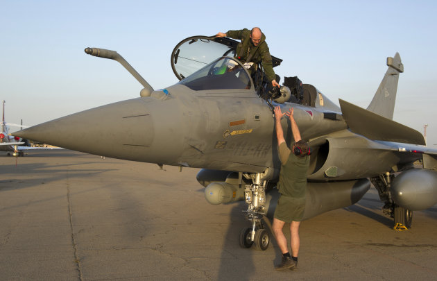 This Sunday Jan.13, 2013 photo provided by the French Army Monday Jan.14, 2013 shows a pilot exiting a jetfighter after a mission to Mali in N'Djamena, Chad. French fighter jets bombed rebel targets i