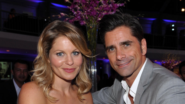 Candace Cameron Bure, left, and John Stamos attend the Starlight Awards at the Skirball Cultural Center on Wednesday, Sept. 25, 2013, in Los Angeles. (Photo by John Shearer/Invision for Starlight Children's Foundation/AP Images)