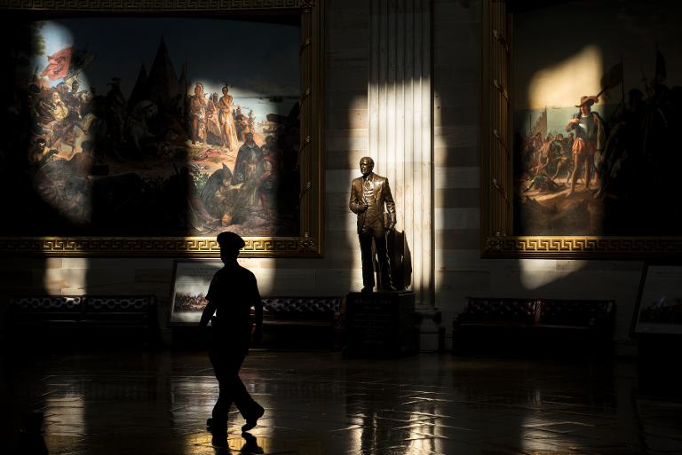 A US Capitol Police officer walks through the Rotunda of the US Capitol while the building was closed to tours on October 1, 2013 in Washington