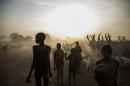 South Sudanese children from the Dinka ethnic group pose at cattle camp in the town of Yirol, in central South Sudan on February 12, 2014