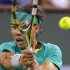 Rafael Nadal, of Spain, returns a shot to Roger Federer, of Switzerland, during their match at the BNP Paribas Open tennis tournament, Thursday, March 14, 2013, in Indian Wells, Calif. (AP Photo/Mark J. Terrill)