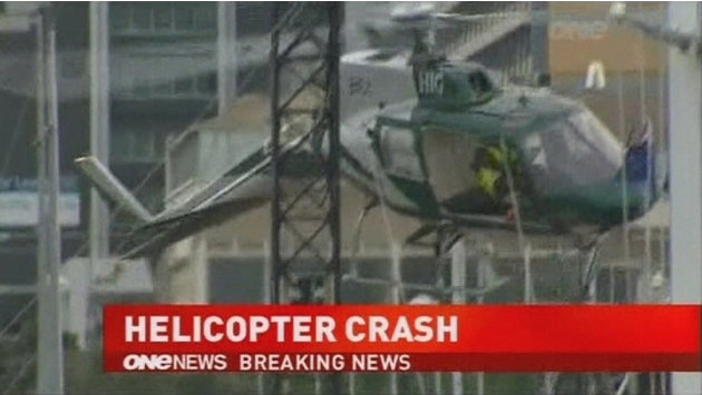A helicopter crashes while installing a Christmas tree in Auckland in this still image taken from video