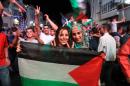 Palestinians celebrate in the West Bank city of Ramallah on May 30, 2014, after Palestine qualified for their maiden Asian Cup appearance with a 1-0 win over injury-hit Philippines in the final of the AFC Challenge Cup in Maldives