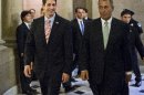 Walking with House Speaker John Boehner, R-Ohio, right, Rep. Paul Ryan, R-Wis., the Republican vice presidential candidate, returns to Capitol Hill to vote on a stopgap spending bill that avoids a government shutdown but carries a price tag $19 billion higher than the budget he wrote as chairman of the House Budget Committee, in Washington, Thursday, Sept. 13, 2012. (AP Photo/J. Scott Applewhite)