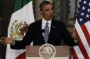 U.S President Obama speaks beside Mexico's President Enrique Pena Nieto (not pictured) during a news conference after attending a bilateral meeting at the National Palace in Mexico City