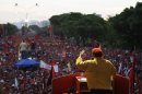 FILE - In this July 14, 2012 file photo, Venezuela's President Hugo Chavez speaks to supporters at a campaign rally in Barquisimeto, Venezuela. When he takes the stage at campaign rallies, Chavez stands alone. Under Venezuela's election system, presidential hopefuls don't choose running mates. The lack of a No. 2 leaves voters with a big unknown ahead of next month's presidential election and raises question about who in fact would take over were Chavez to win and leave office prematurely. (AP Photo/Ariana Cubillos,File)