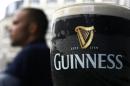 Pint of Guinness beer is seen outside a pub in London