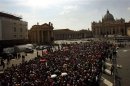 Pilgrims queue outside Saint Peter's Basilica as they wait to pay their respects to the late ...