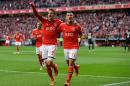 Benfica's Lima, right, celebrates with teammate Rodrigo after scoring the opening goal during their Portuguese league soccer match with Academica Sunday, March 23 2014, at Benfica's Luz stadium in Lisbon. (AP Photo/Armando Franca)