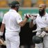 South Africa's Amla celebrates his century against Australia with his teammate Kallis during the first cricket test match at the Gabba in Brisbane