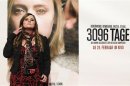 Austrian kidnap victim Natascha Kampusch poses in front of a film poster before the premiere of the film "3,096 Days" in a cinema in Vienna