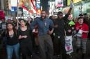 Protesters march through Times Square during a demonstration against police violence in Manhattan