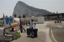 A man pulls his suitcases after leaving the British territory of Gibraltar at its border with Spain in La Linea de la Concepcion
