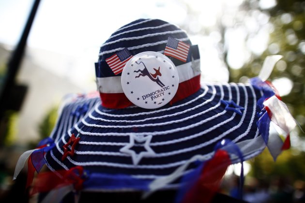 A woman wears a hat in the Charlotte Labor Day Parade in Charlotte, North Carolina September 3, 2012. The Democratic National Convention opens in Charlotte this week. REUTERS/Eric Thayer (UNITED STATES - Tags: POLITICS ELECTIONS CIVIL UNREST BUSINESS EMPLOYMENT)