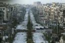 A general view shows a damaged street with sandbags used as barriers in Aleppo's Saif al-Dawla district