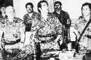 FILE - In this March 23, 1982 photo, General Efrain Rios Montt, center, speaks at a press conference in Guatemala City, where he announced the formation of a junta in the aftermath of the overthrow of General Fernando Romeo Lucas Garcia's right wing government. At left is General Horacio Maldonado Shad and right is Colonel Luis Frandisco Gordillo. Rios Montt rose to power in this March 23, 1982 coup d'etat, holding absolute power for just over a year before he himself was overthrown. Rios Montt has ruled as Guatemala's dictator, served as president of Congress, preached as an evangelical pastor and now, at 87, has become the first Latin American strongman to stand trial on genocide charges in his own country. (AP Photo, File)