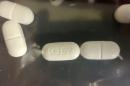 This photo shows counterfeit tablets seized by the DEA