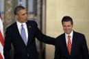 President Barack Obama and Mexico's President Enrique Pena Nieto, right, leave after offering a joint news conference in Mexico City, Mexico, Thursday, May 2, 2013. Seeking to put a new spin on a long-standing partnership, Obama is promoting jobs and trade - not drug wars or border security - as the driving force behind the U.S.-Mexico relationship. (AP Photo/Dario Lopez-Mills)