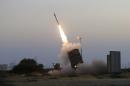 An Iron Dome air defense system fires to intercept a rocket from Gaza Strip in the costal city of Ashkelon, Israel, Saturday, July 5, 2014. The Israeli military said its 