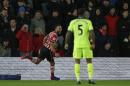 Southampton's Nathan Redmond (L) celebrates after scoring a goal during their League Cup semi-final first leg match against Liverpool, at St Mary's Stadium in Southampton, on January 11, 2017