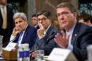 Secretary of State John Kerry, left, and Treasury Secretary Jacob Lew, center, listen as Defense Secretary Ash Carter, right, testifies on Capitol Hill in Washington, Wednesday, July 29, 2015, before the Senate Armed Services Committee hearing on the impacts of the Joint Comprehensive Plan of Action (JCPOA) on U.S. Interests and the Military Balance in the Middle East. (AP Photo/Andrew Harnik)