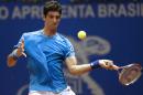 Brazil's Thomaz Bellucci returns the ball to Colombia's Santiago Giraldo at the Brazil Open ATP tournament tennis match in Sao Paulo, Brazil, Tuesday, Feb. 25, 2014. (AP Photo/Andre Penner)