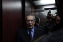 Former Guatemalan dictator Efrain Rios Montt stands in an elevator after a hearing in the Supreme Court of Justice in Guatemala City