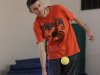 In this photo taken Oct. 16, 2012, Austin Benavidez, who is blind, returns a volley using an oversized ball filled with ball bearings at the California School for the Blind in Fremont, Calif. Students at the school are learning to play tennis, and expanding the boundaries of what the blind can do while offering new insights into the human mind. They must turn their ears into eyes, listening for the ball's bounce to figure out where to swing their rackets. (AP Photo/Ben Margot)