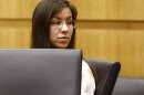 Jodi Arias looks at her family on Monday, May 20, 2013 during the penalty phase of her murder trial at Maricopa County Superior Court in Phoenix, Ariz. Arias was convicted of first-degree murder in the stabbing and shooting to death of Travis Alexander, 30, in his suburban Phoenix home in June 2008. (The Arizona Republic, Rob Schumacher, Pool)