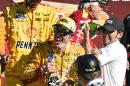 Joey Logano celebrates in the victory lane after winning a NASCAR Sprint Cup series auto race at Watkins Glen International, Sunday, Aug. 9, 2015, in Watkins Glen. N.Y. (AP Photo/Derik Hamilton)