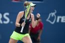 Belinda Bencic of Switzerland celebrates her win in the first set tie breaker against Simona Halep of Romania during their Rogers Cup tennis final in Toronto, Canada on August 16, 2015