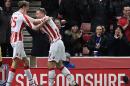 Stoke City's Peter Crouch (L) celebrates with teammate Ryan Shawcross after scoring their second goal against Watford in Stoke-on-Trent, central England on January 3, 2017