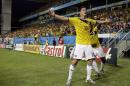 Colombia's James Rodriguez celebrates after scoring during the group C World Cup soccer match between Japan and Colombia at the Arena Pantanal in Cuiaba, Brazil, Tuesday, June 24, 2014. (AP Photo/Felipe Dana)