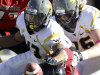 West Virginia's Andrew Buie, center, fumbles the ball after a hit by Texas Tech's Kerry Hyder, bottom, during their NCAA college football game in Lubbock, Texas, Saturday, Oct. 13, 2012. (AP Photo/Lubbock Avalanche-Journal, Scott MacWatters) LOCAL TV OUT