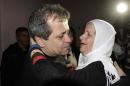 Released Palestinian prisoner Moayyad Hajji, 46, who was arrested in 1992, hugs his sister upon his arrival at his family's house in the West Bank village of Burqa near Nablus