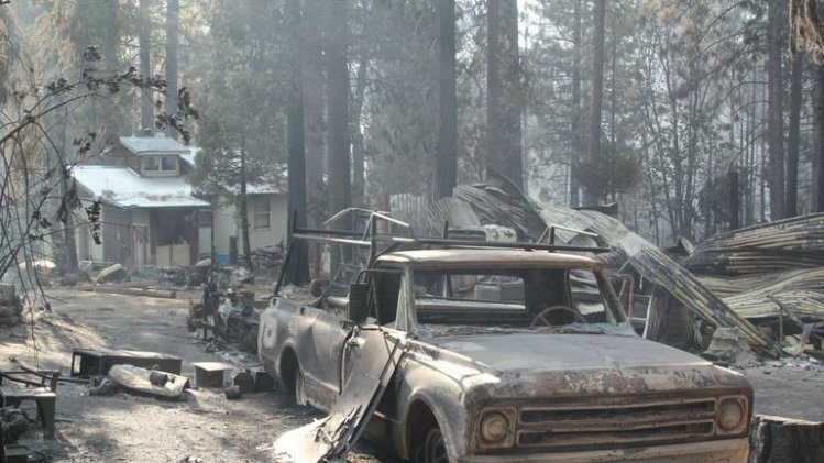 A pick-up truck and buildings destroyed by the Rim Fire, August 28, 2013